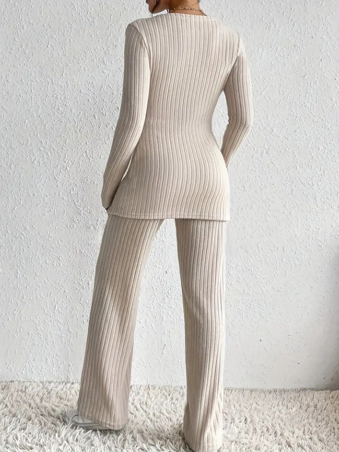 Ribbed knit lounge set in Dust Storm, featuring a long sleeve top and wide leg pants.