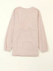 Eggshell corded sweatshirt with long sleeves and crewneck.