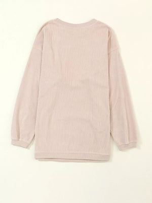 Eggshell corded sweatshirt with long sleeves and crewneck.