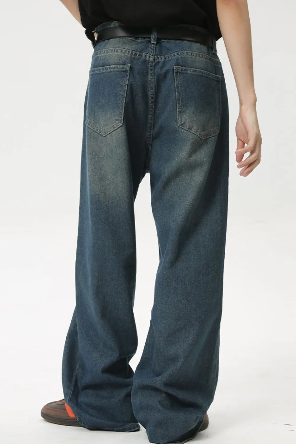 Baggy denim jeans in medium wash with subtle fading and a relaxed fit.