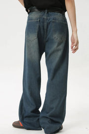 Baggy denim jeans in medium wash with subtle fading and a relaxed fit.