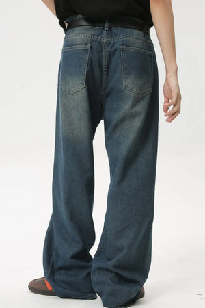 Baggy denim jeans in medium wash with subtle fading and a relaxed fit.