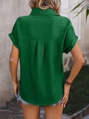 Dark green textured button-down shirt with cuffed short sleeves and a relaxed fit.