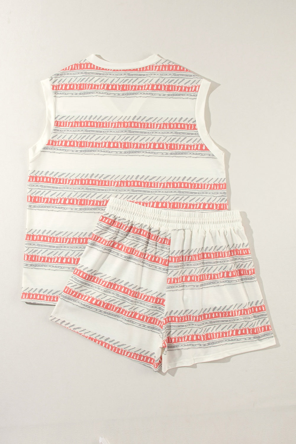 Striped knit tank and drawstring shorts set in ivory with coral and grey pattern.