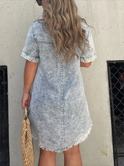 Grey denim short sleeve dress with frayed hem and a relaxed fit.