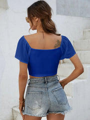 Royal blue ribbed crop top with chiffon sleeves and square neckline.
