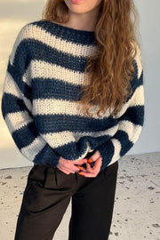 Off-shoulder knit sweater with voluminous sleeves in indigo and cream stripes.