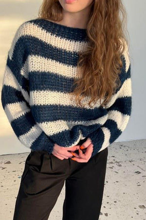 Off-shoulder knit sweater with voluminous sleeves in indigo and cream stripes.