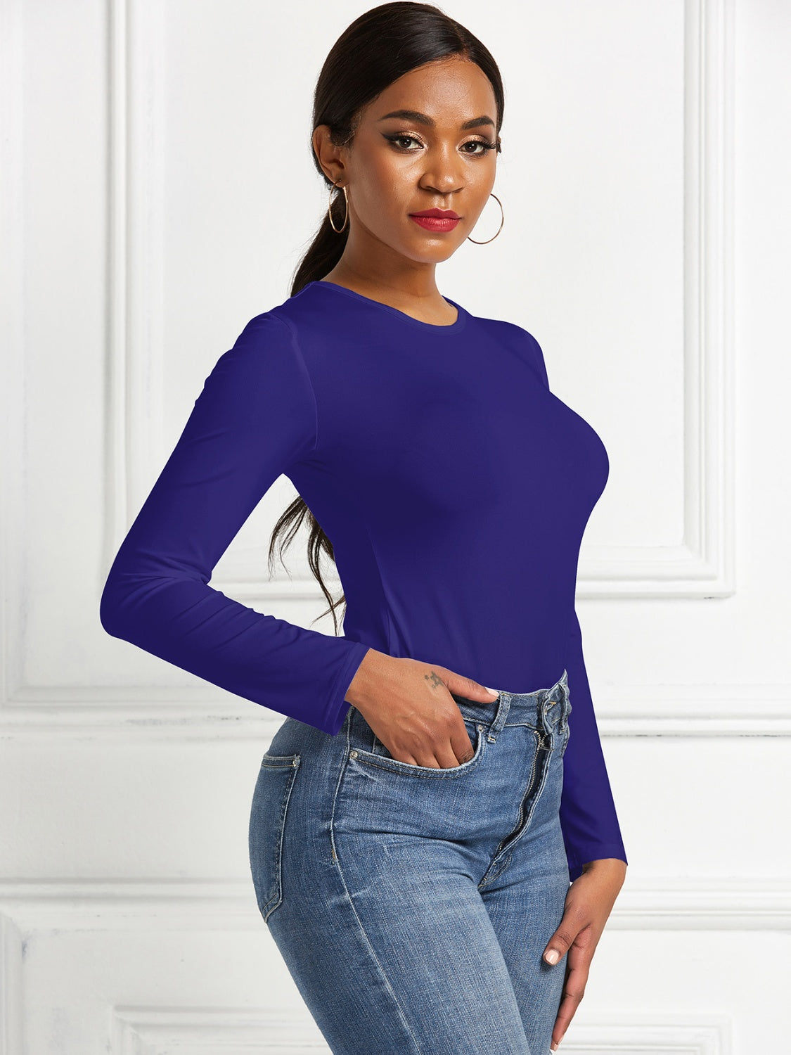 Sculpted ribbed jersey bodysuit in dark blue with long sleeves and a crew neck.