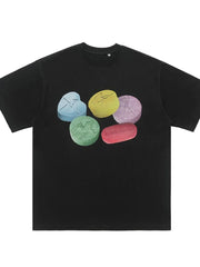 Black cotton crew neck t-shirt with graphic print of colorful pills.
