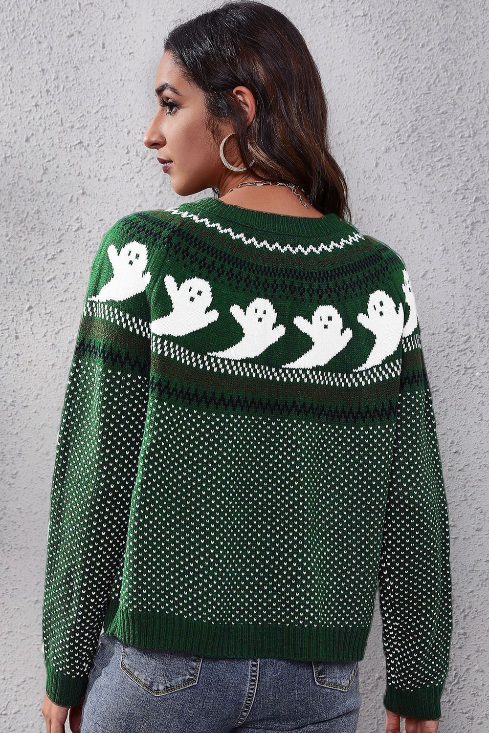 Green acrylic crewneck sweater with white ghost pattern and jacquard knit.