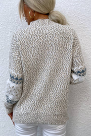 Nordic Fair Isle mock neck knit sweater in Sand with diamond pattern and blue cuff detail.
