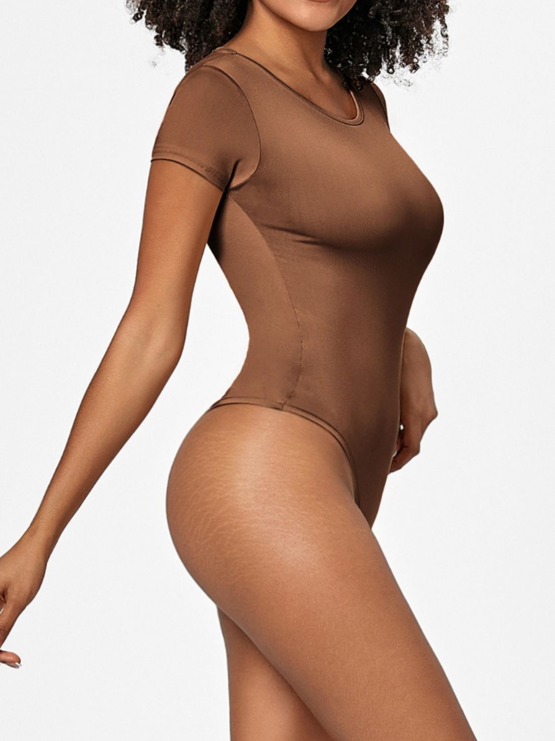 Sculpted scoop-neck bodysuit in Coffee Brown with short sleeves and a thong bottom.