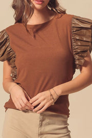 Brown ribbed knit blouse with ruffled faux leather short sleeves.