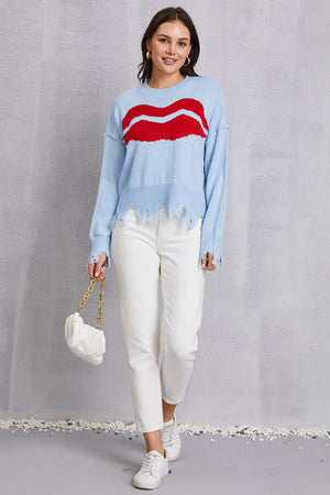 Light Blue Kiss Graphic Distressed Hem Sweater with red lips pattern, acrylic knit, crew neck, long sleeves, and frayed hem.