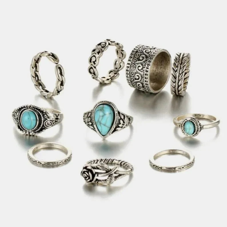 Bohemian silver rings with turquoise stones, featuring ornate and floral designs.