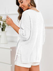 White textured knit boat neck sweater with slit hem detail