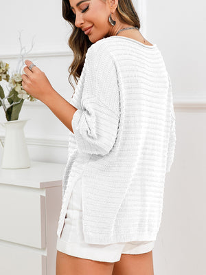White textured knit boat neck sweater with slit hem detail