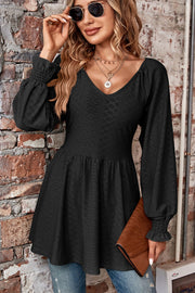 Black textured empire waist blouse with shirred sleeves and v-neck