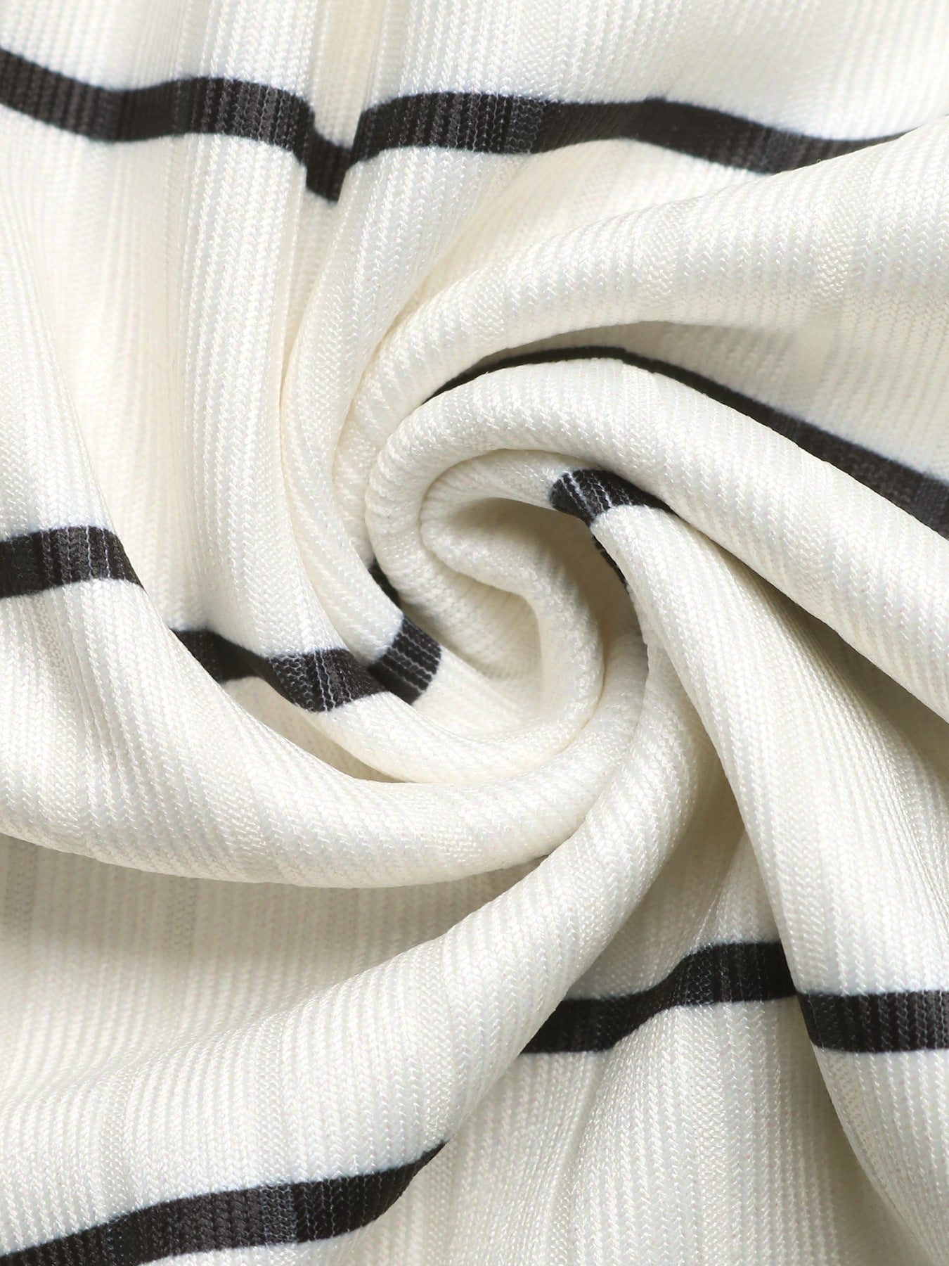 Sleeveless ribbed knit midi dress in cream with black stripes, form-fitting silhouette.