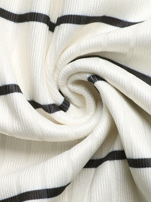Sleeveless ribbed knit midi dress in cream with black stripes, form-fitting silhouette.