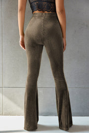 Ribbed velvet palazzo trousers in brown, with a flared leg and high waist.