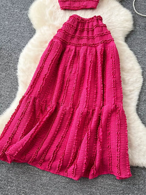 Rose red ruched polyester crop top and maxi skirt set with frill details.