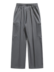 Plus-size dark gray cargo pants with drawstring waist and zippered pockets.