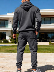 Men's dark gray cargo sweatpants with elastic cuffs and patch pockets.