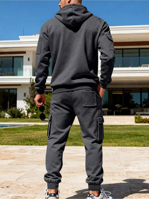 Men's dark gray cargo sweatpants with elastic cuffs and patch pockets.