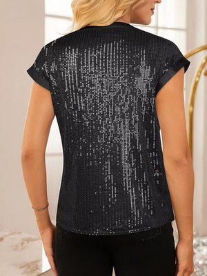 Black sequin cap sleeve blouse with satin trim, a dazzling party top.