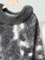 Faux fur trimmed camo poncho in dark gray with a textured knit and tie-dye pattern.