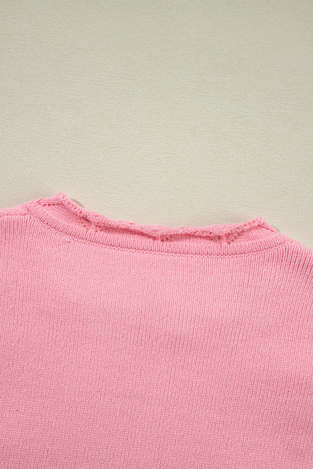 Blush pink knit sweater with notch neck detail
