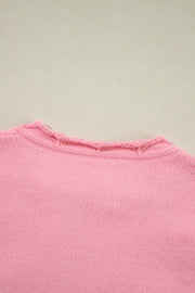 Blush pink knit sweater with notch neck detail