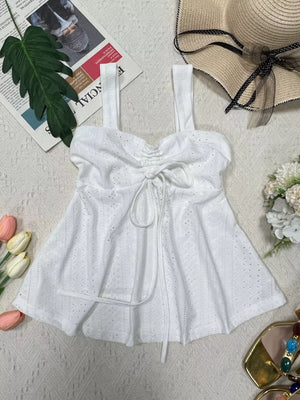 White eyelet camisole with sweetheart neckline and drawstring detail.