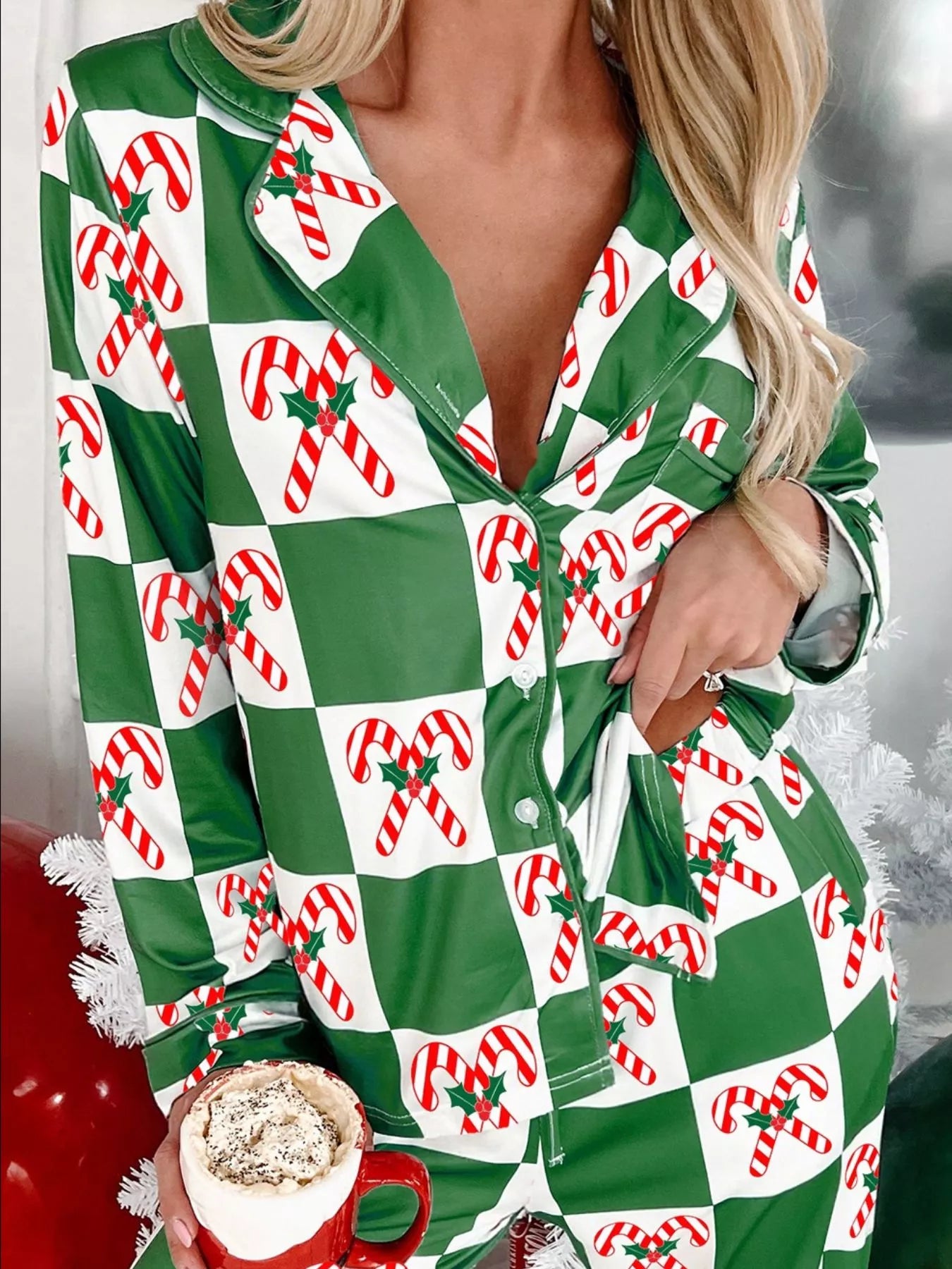 Green checkered pajama set with candy cane print, buttoned top and pockets.