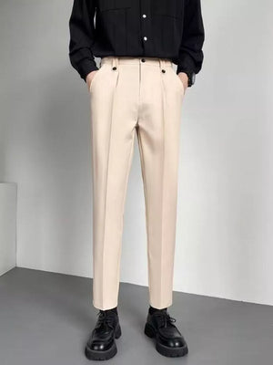 Men's beige slim fit ankle-length trousers with double button detail and front pleats.