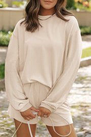 Chic monochrome matching set in Dust Storm with vertical stripes, long sleeves, and shorts.