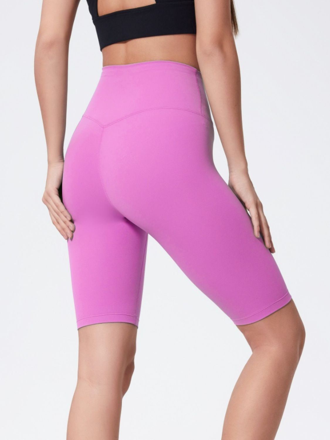 Sculpted Active Bike Shorts in pink purple with a high waist and V-seam detail.