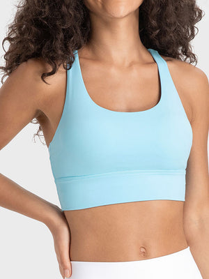 Pastel blue sports bra with crisscross back detail and wide band