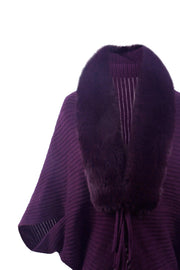 Violet knit cape with faux fur collar and fringe detail