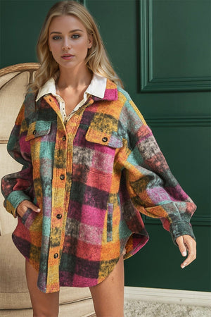 Oversized multicolored plaid shacket with white collar and button front.