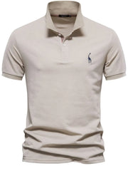Khaki piqué polo shirt with giraffe embroidery and striped collar detail.
