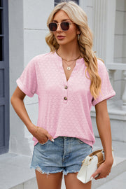 Blush pink textured henley tee with rolled sleeves and button detail