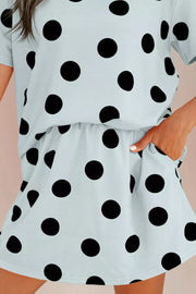 Light blue polka dot two-piece outfit set with crew neck top and shorts with pockets.