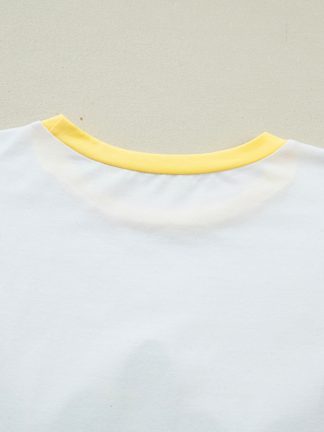 White cotton t-shirt with yellow crew neck detail