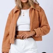 Ochre textured sherpa cropped jacket with collar and zip front, styled with a white crop top.