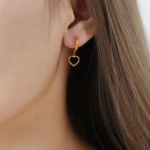 Gold hoop earrings with black enamel heart charms