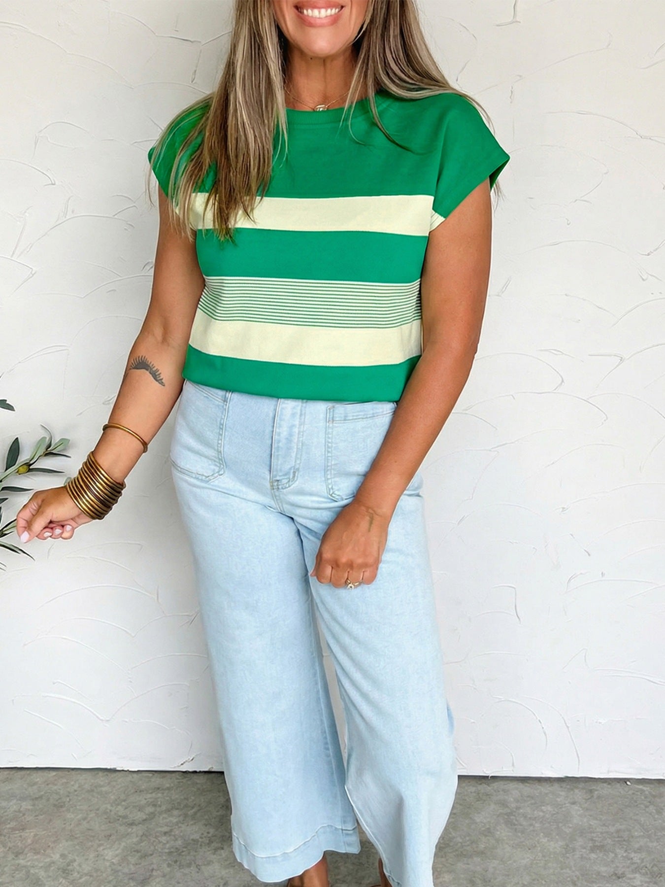 Green and cream striped cap sleeve t-shirt with crew neck.
