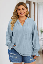 Light blue textured blouse with slit neck and shirred cuffs